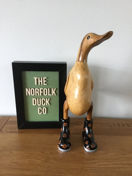 Small duck in Flowery painted boots